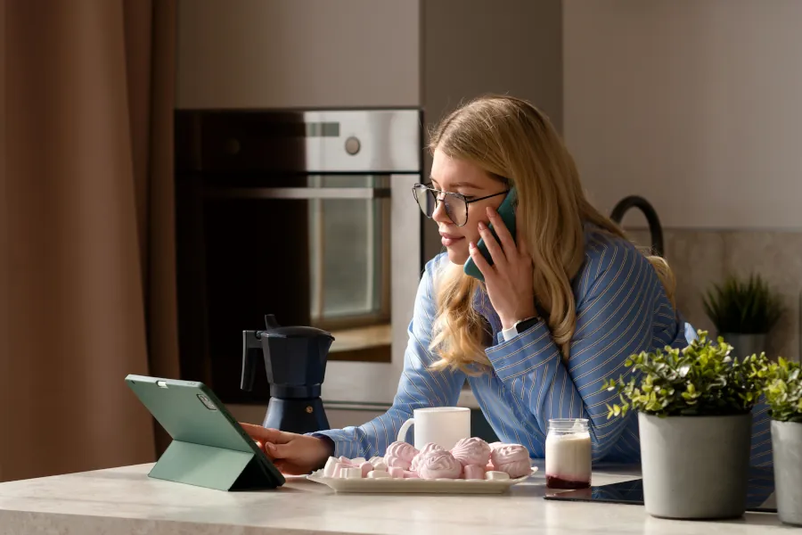 Woman On Phonecall In Kitchen